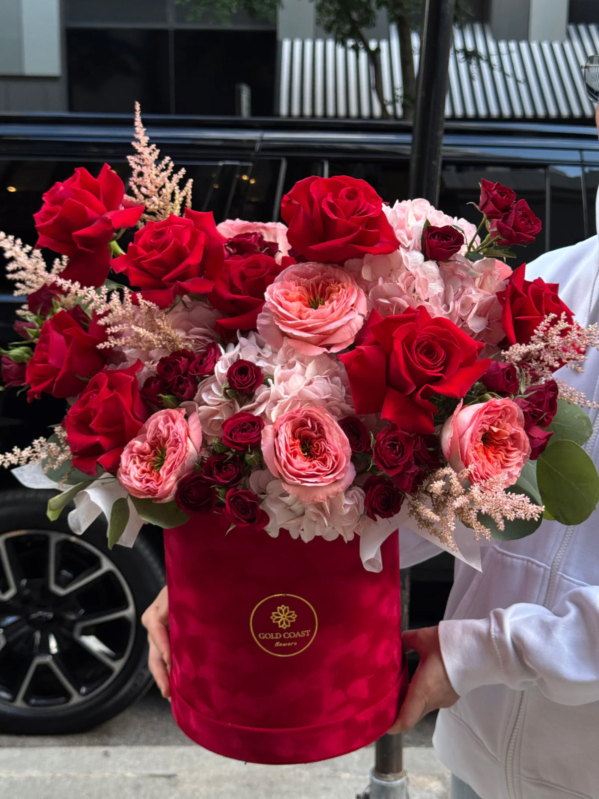 Passion Red & Pink Roses Hatbox rose arrangement by Gold Coast Flowers in Chicago