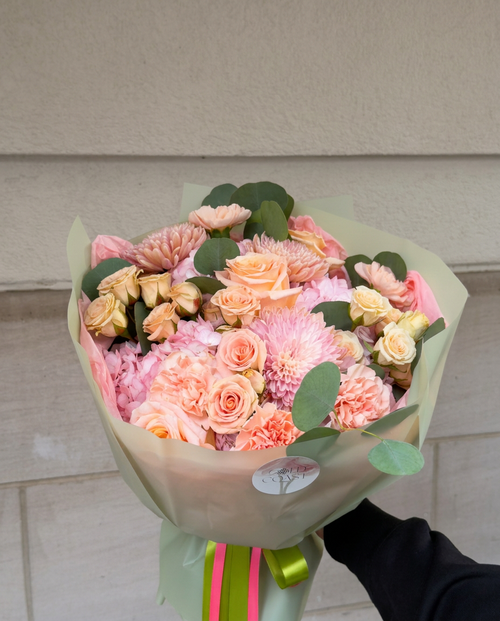 Peach and pink rose bouquet with chrysanthemums, carnations and eucalyptus in Chicago